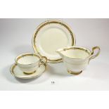 A Paragon gilt and white tea service retailed by Lawleys, including ten cups, eight saucers,