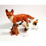 A Beswick large fox, a Doulton dog with ball and another dog