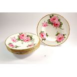 A set of five soup dishes painted roses with T Goode & Co. label