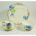 A Paragon 1930's tea service painted blue flowers comprising: six cups, ten saucers, twelve side