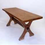 A Victorian pine refectory dining table on X frame supports, 180 x 69 cm