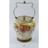 A Carlton Ware biscuit barrel with silver plated mounts