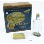 A Medocreme cube tin, a Horlicks Tablets tin and a Woodwards chemist bottle
