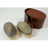 A pair of silver backed toiletry brushes