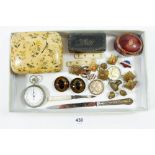 A box of collectables including military buttons, seals, stop watch, pair of glass eyes, silver