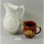 A Victorian press moulded jug, decorated angels and babies and a Dartmouth Pottery Widdicombe Fair