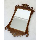 A Georgian style mahogany fretwork framed mirror with gilt ho ho bird surmount, 67 x 41 cm