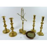 Two pairs of brass candlesticks and a brass set of balance scales