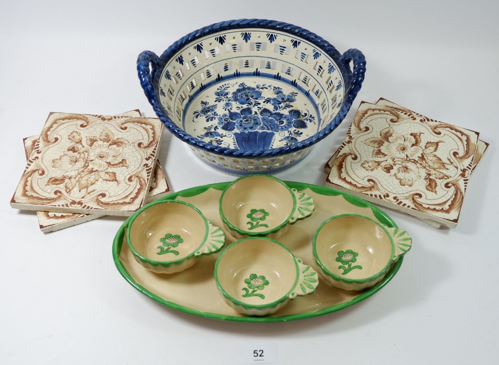 A Gustavesberg set of four entree dishes on stand, four tiles and a Delft basket