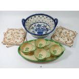 A Gustavesberg set of four entree dishes on stand, four tiles and a Delft basket