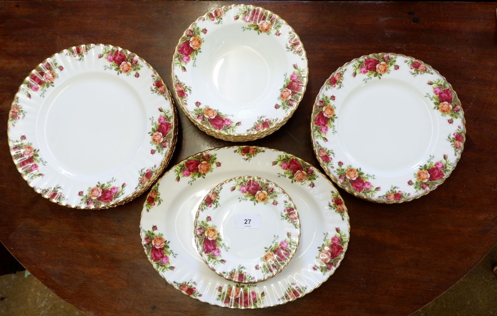 A Royal Albert 'Country Roses' dinner service comprising: meat plate, seven soup plates, six