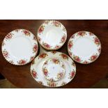 A Royal Albert 'Country Roses' dinner service comprising: meat plate, seven soup plates, six