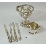 A silver plated pierced sugar bowl, four silver handled tea knives and a small silver sugar bowl,