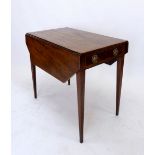 A 19th century mahogany Pembroke table on square tapered supports