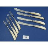 A set of four Victorian silver and mother of pearl fruit knives and forks, London 1899