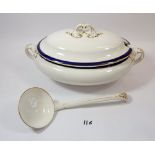 A large early 20th century tureen and lid with ladle