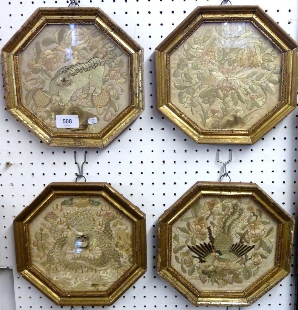 A set of four 19th century Chinese embroidered octagonal pictures of flowers, birds and dragons,