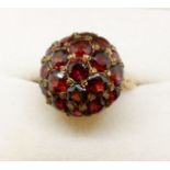 A 9 carat gold vintage dome form ring set garnets, 5g, size M to N