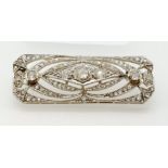 An Art Deco rectangular diamond brooch with central lozenge design, cased, 4.7 x 1.8cm, 10.7g