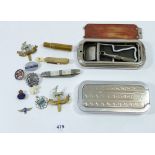 A box of military badges and collectables