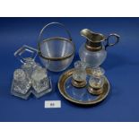 A cut glass Art Deco cruet set on stand, a glass salt and pepper and a ribbed glass milk jug and