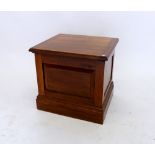 A Victorian walnut commode with rise top, inner seat and pottery liner