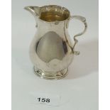 A Spinks & Son silver cream jug, London 1965, 131.4g