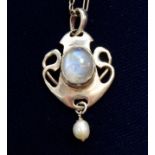 An Art Nouveau silver pendant set moonstone and pearl drop on silver chain