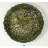 A Mary Seton Watts Compton Pottery dish with vine decoration, 27cm diameter