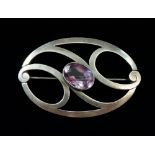 A Murrle Bennett Art Nouveau silver and amethyst openwork brooch, 18g, 6cm wide