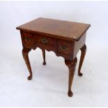 A 20th century walnut low boy with three frieze drawers and shell case cabriole supports, 68 x 45