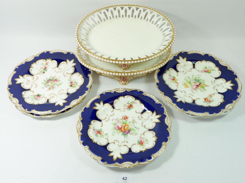 Five Victorian dessert plates painted flowers on a gilt and blue ground and a pair of oval serving