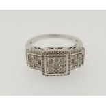An 18 carat white gold Art Deco style ring with square set triple diamond panels, size O to P, 8.4g