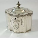 A George III silver tea caddy with engraved armorial and crest, London 1788 by William Plummer, 455g