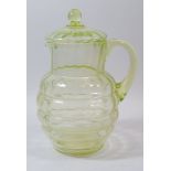 A 1930's green glass lemonade jug with lid