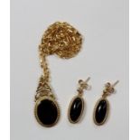 A 9ct gold pendant set black onyx and chain and a pair of earrings, 11.1g total
