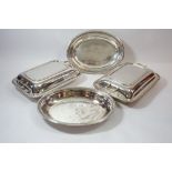 A pair of silver plated entree dishes and a pair of oval dishes