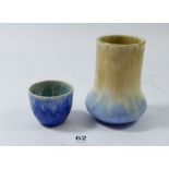 A small Ruskin beige and blue vase and blue Ruskin egg cup