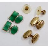 A pair of yellow metal and green stone cufflinks, a pair of gold plated cufflinks and two studs