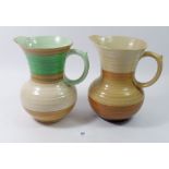 Two Shelley Art Deco Harmony jugs in green and brown, 18cm tall