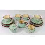 A collection of vintage polka dot Devonshire Pottery tea ware comprising: four cups and saucers,
