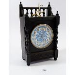 A Victorian ebonised mantel clock with blue floral dial, 24cm tall