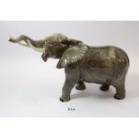 A large Beswick elephant, tusk a/f, 25cm tall