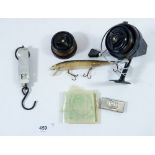 A fishing reel and a plug lure etc.