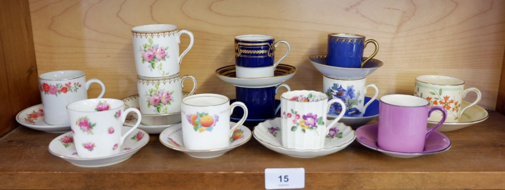 A collection of twelve decorative coffee cans and saucers