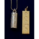 A 9 carat gold ingot pendant 15g and a silver one 38g
