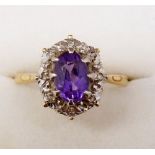 An 18ct gold amethyst and diamond cluster ring, size S to T, 3.7g