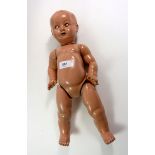 A vintage composition doll with cry