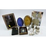 A box of silver plated picture frames, honey pot, cruets etc.