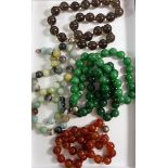 Four large stone bead necklaces and one bracelet